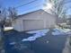 Detached garage with double doors and paved driveway at 2147 W 65Th St, Indianapolis, IN 46260