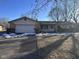 Ranch-style home with attached garage and front yard at 2147 W 65Th St, Indianapolis, IN 46260