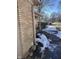 Brick house with gutters and walkway, snow on ground at 2147 W 65Th St, Indianapolis, IN 46260