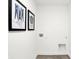 Bright laundry room with tiled floor, recessed shelving and framed wall art at 2738 Linwood Ave, Greenwood, IN 46143