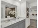 Elegant double vanity bathroom with gray cabinets and a walk-in shower at 3872 Branch Cir, Franklin, IN 46131