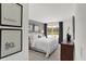 Peaceful bedroom with gray accent wall and large window at 3872 Branch Cir, Franklin, IN 46131