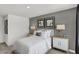 Modern bedroom with gray accent wall and white bedding at 3872 Branch Cir, Franklin, IN 46131