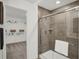 Large walk-in shower with modern gray tile and glass enclosure at 3872 Branch Cir, Franklin, IN 46131