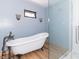 Bathroom with clawfoot tub and glass shower at 404 N State St, Greenfield, IN 46140