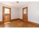 Charming bedroom with hardwood floors and wood window shutters at 404 N State St, Greenfield, IN 46140