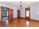 Bright bedroom featuring hardwood floors and an ensuite at 404 N State St, Greenfield, IN 46140