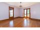 Spacious bedroom with hardwood floors and large windows at 404 N State St, Greenfield, IN 46140