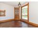 Charming built-in corner cabinet in hardwood dining room at 404 N State St, Greenfield, IN 46140