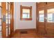 Front entry with hardwood floors and original woodwork at 404 N State St, Greenfield, IN 46140