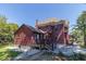 Rear view of the renovated home, highlighting the deck and landscaping at 404 N State St, Greenfield, IN 46140