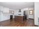 Remodeled kitchen with white cabinets, stainless steel appliances, and kitchen island at 404 N State St, Greenfield, IN 46140
