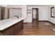 Remodeled kitchen with white cabinets, stainless steel appliances, and kitchen island at 404 N State St, Greenfield, IN 46140