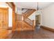 Ornate wooden staircase in a grand entryway at 404 N State St, Greenfield, IN 46140