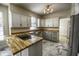 Kitchen with butcher block countertops, farmhouse sink, and white cabinets at 415 Calamus Ct, Indianapolis, IN 46239