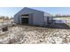 Gray barn with open doors and a horse at 4462 S Morgantown Rd, Greenwood, IN 46143