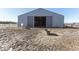 Gray barn with open doors and a horse at 4462 S Morgantown Rd, Greenwood, IN 46143