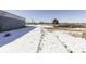 Snowy barnyard with tire tracks and building at 4462 S Morgantown Rd, Greenwood, IN 46143