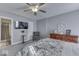 Spacious bedroom with ensuite bathroom access and ceiling fan at 4462 S Morgantown Rd, Greenwood, IN 46143
