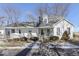 Charming white farmhouse with wrap-around porch and mature trees at 4462 S Morgantown Rd, Greenwood, IN 46143