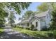 Inviting two-story house with a covered front porch, set on a tree-lined lot at 4462 S Morgantown Rd, Greenwood, IN 46143