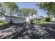 Charming home and garage, both freshly painted, with a large driveway and lush trees at 4462 S Morgantown Rd, Greenwood, IN 46143