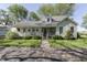 Charming home with a welcoming front porch, lush lawn, and beautiful landscaping at 4462 S Morgantown Rd, Greenwood, IN 46143
