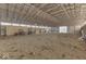 Indoor riding arena with dirt floor and ATV at 4462 S Morgantown Rd, Greenwood, IN 46143