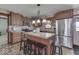 Modern kitchen with stainless steel appliances and a large island with seating at 4462 S Morgantown Rd, Greenwood, IN 46143