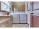 Convenient laundry room with washer, dryer, and cabinets at 4462 S Morgantown Rd, Greenwood, IN 46143