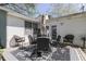Outdoor patio with dining set, ideal for al fresco dining, and decorated with an umbrella at 4462 S Morgantown Rd, Greenwood, IN 46143