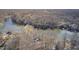 Aerial photograph of lakefront homes surrounded by dense trees and a connecting bridge at 459 W Lakeview Dr, Nineveh, IN 46164