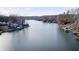 Scenic aerial view of waterfront homes along a tranquil, wide river, offering serene natural beauty at 459 W Lakeview Dr, Nineveh, IN 46164
