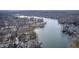 High-angle view of homes along a winding lake surrounded by dense, bare trees at 459 W Lakeview Dr, Nineveh, IN 46164