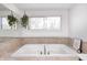 Relaxing bathroom featuring a large soaking tub and a window offering natural light at 459 W Lakeview Dr, Nineveh, IN 46164