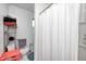 Clean bathroom with a shower, toilet, and shelving unit at 459 W Lakeview Dr, Nineveh, IN 46164