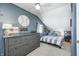 Charming bedroom with a baseball-themed decor, dresser, and comfortable bed at 459 W Lakeview Dr, Nineveh, IN 46164