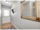 Bright entryway with a mirror, coat hooks, and wood flooring at 459 W Lakeview Dr, Nineveh, IN 46164