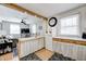 Open kitchen boasts a breakfast bar and white appliances, overlooking the living room at 459 W Lakeview Dr, Nineveh, IN 46164