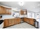 Updated kitchen featuring wood cabinets, white tile backsplash, and stainless steel appliances at 459 W Lakeview Dr, Nineveh, IN 46164