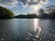 Sunny view of lake with houses and trees at 459 W Lakeview Dr, Nineveh, IN 46164