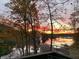 Stunning sunrise over lake with fall foliage at 459 W Lakeview Dr, Nineveh, IN 46164