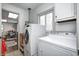 Convenient laundry room with washer, dryer, and access to play area at 459 W Lakeview Dr, Nineveh, IN 46164