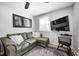 Relaxing living room with sectional sofa, large TV and ceiling fan at 459 W Lakeview Dr, Nineveh, IN 46164