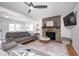 Living room features hardwood floors, fireplace, and large windows at 459 W Lakeview Dr, Nineveh, IN 46164