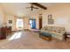 Sunlit living room featuring a comfortable sofa and a piano at 5386 Ridge Hill Way, Avon, IN 46123