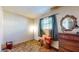 Simple bedroom with wood floors and a dresser at 5806 E 19Th St, Indianapolis, IN 46218