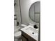 Modern bathroom with white tile, vanity, and black fixtures at 5883 Attleburg Dr N Attleburg Dr, McCordsville, IN 46055