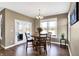 Charming dining area with wood table and chairs near patio doors at 6336 Burgin Dr, Whitestown, IN 46075