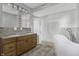 Updated bathroom with double vanity and a free-standing bathtub at 7077 E Mulberry St, Gwynneville, IN 46144